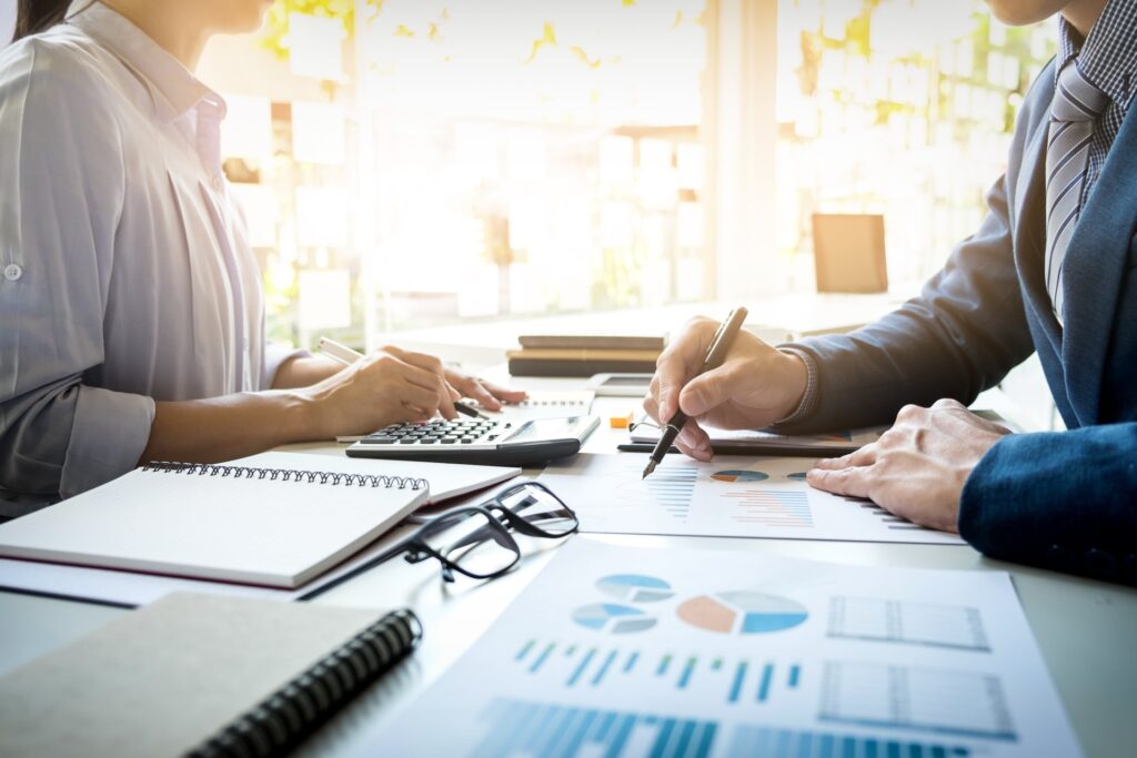 business-man-financial-inspector-secretary-making-report-calculating-checking-balance-internal-revenue-service-inspector-checking-document-audit-concept-min (1)
